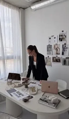 Seller arranging product shots on a desk